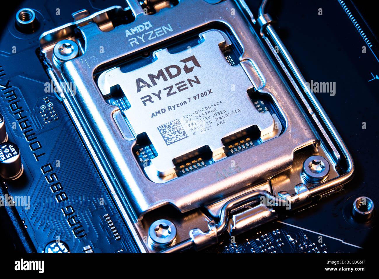 AMD Ryzen 7900x Processor Chip Installed In Cpu Socket On Computer Motherboard Stock Photo