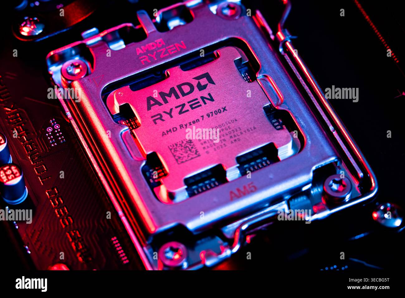 AMD Ryzen 7900x Processor Chip Installed In Cpu Socket On Computer Motherboard Stock Photo