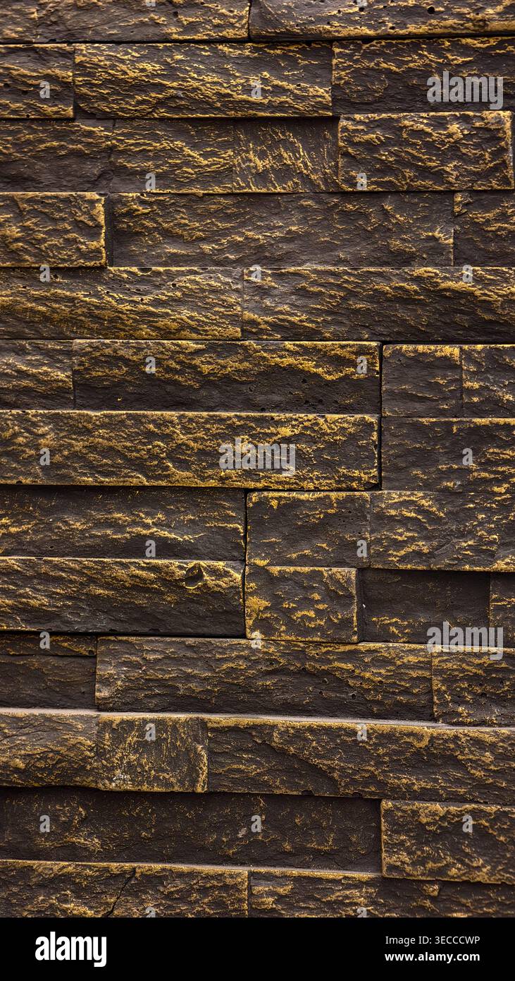 Dark natural stone wall texture with layered black and gray slabs ...