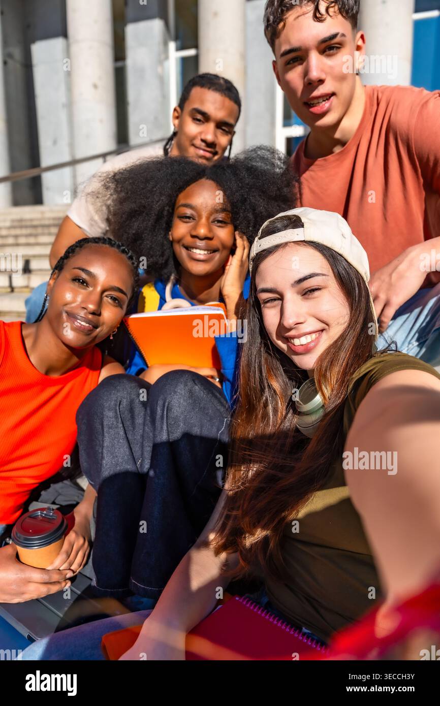 Diverse students taking a selfie on university campus Stock Photo
