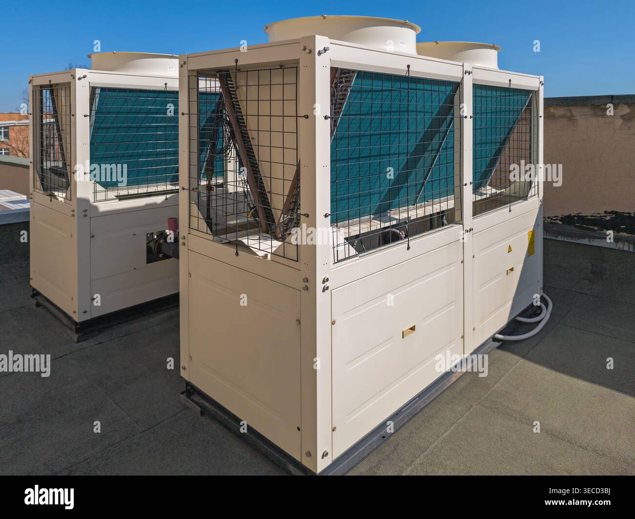 Large outdoor HVAC unit mounted on a rooftop, designed for cooling and ...