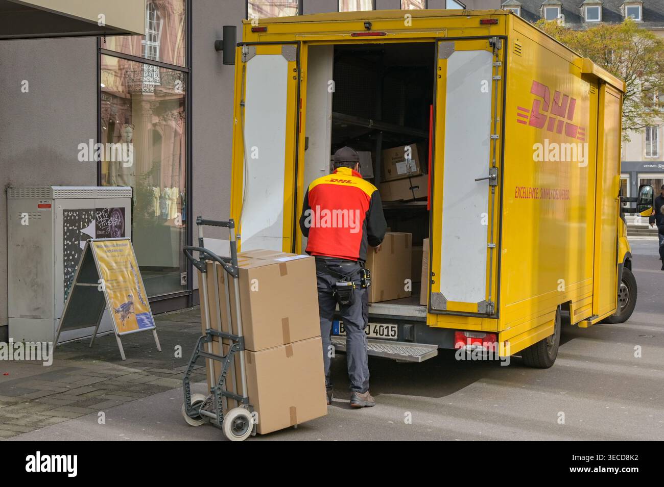 Trier, Germany - 14 April 2026: Delivery driver working for DHL ...