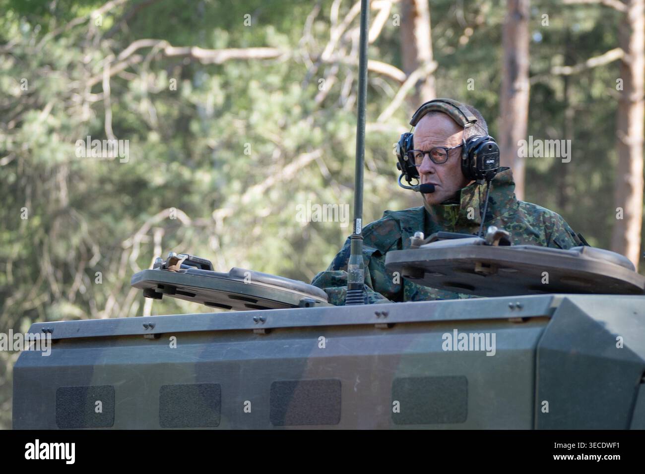 Chancellor Friedrich Merz on a GTK Boxer armored personnel carrier, a ...