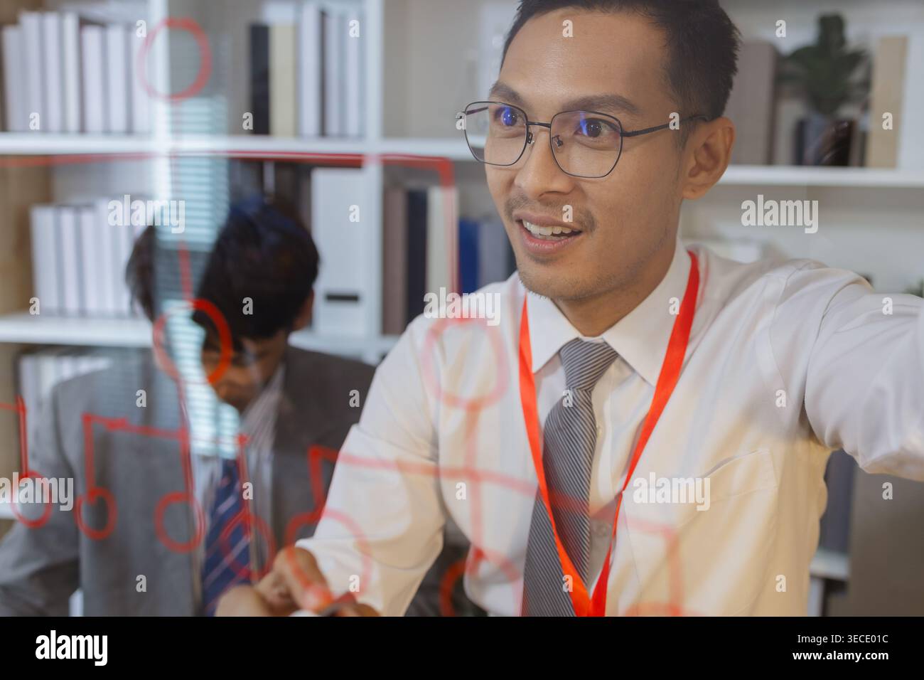 Business professional explaining ideas and planning strategy during meeting, using visual thinking to communicate concepts, solve problems and support Stock Photo