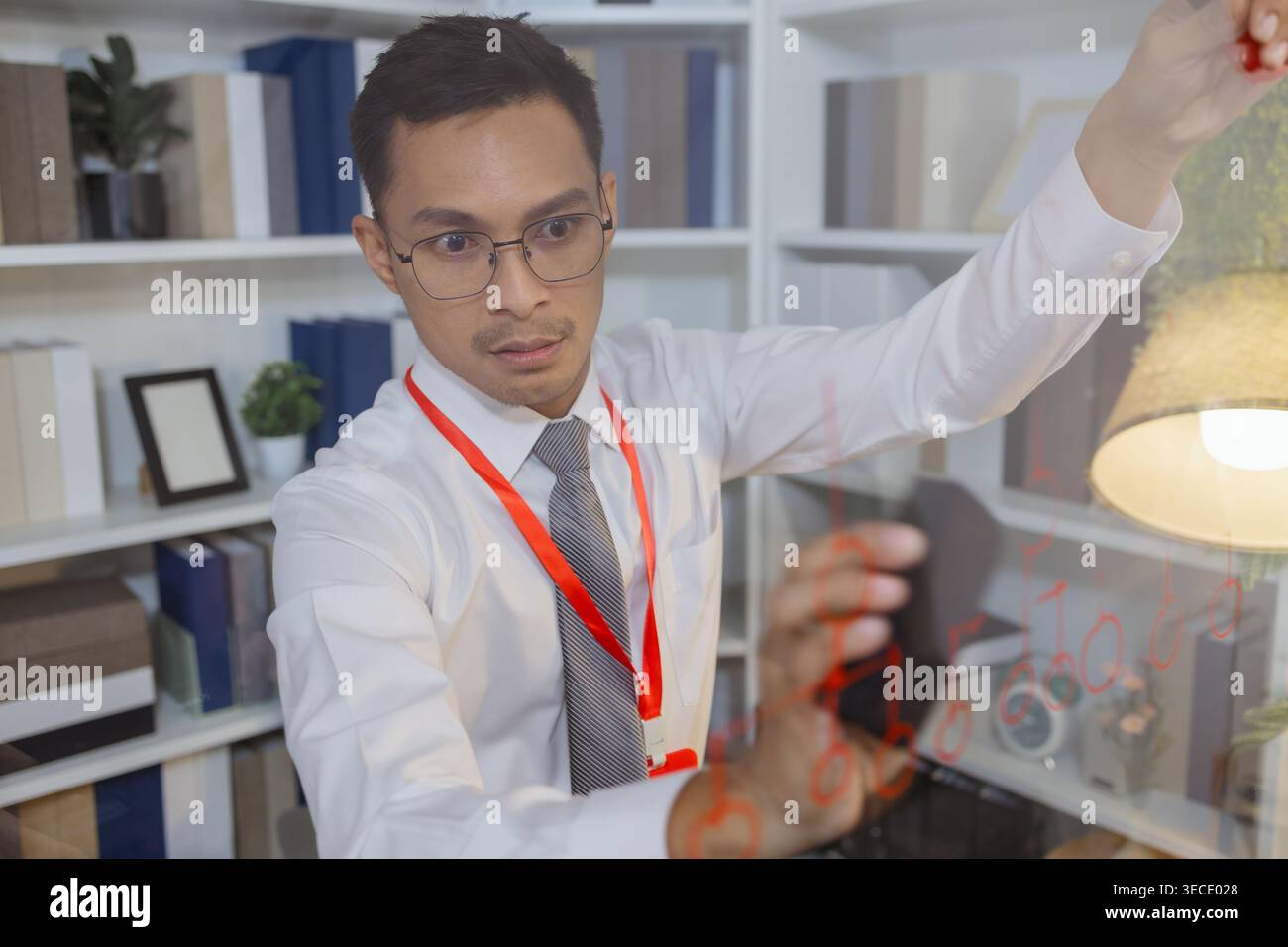 Business professional explaining ideas and planning strategy during meeting, using visual thinking to communicate concepts, solve problems and support Stock Photo