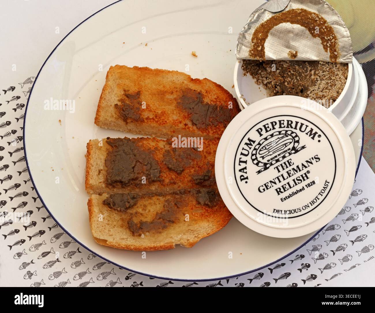 Patum Peperium Gentleman’s Relish, a salty spiced anchovy spread, served thinly on hot buttered toast from its opened pot. Stock Photo