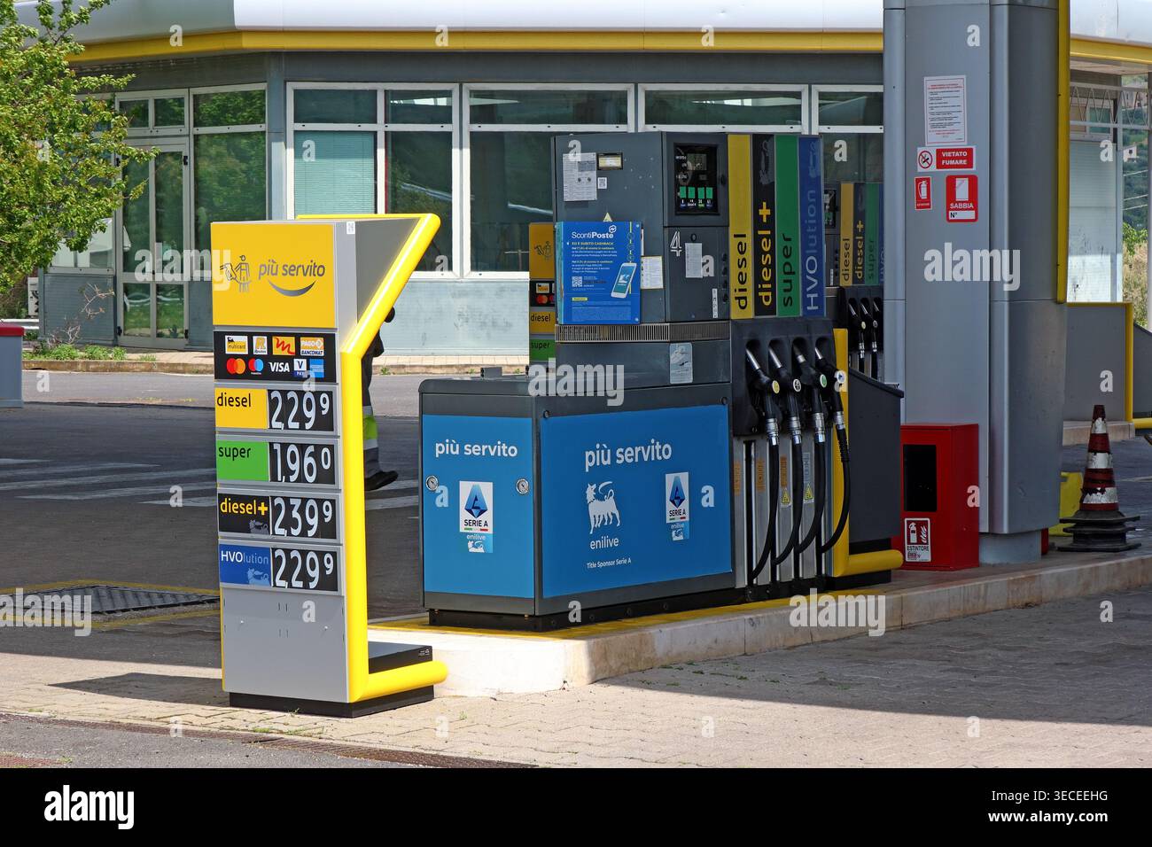 High Italian petrol station prices per litre, with diesel, super, diesel plus and HVOlution displayed during oil market tension. Stock Photo