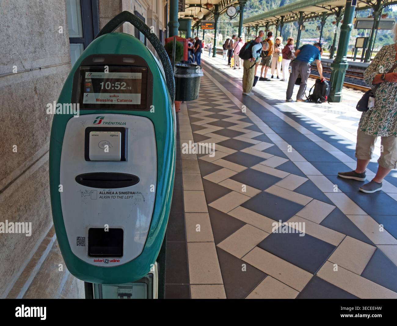 Trenitalia ticket validation, Taormina-Giardini, Sicily, Italy Stock Photo
