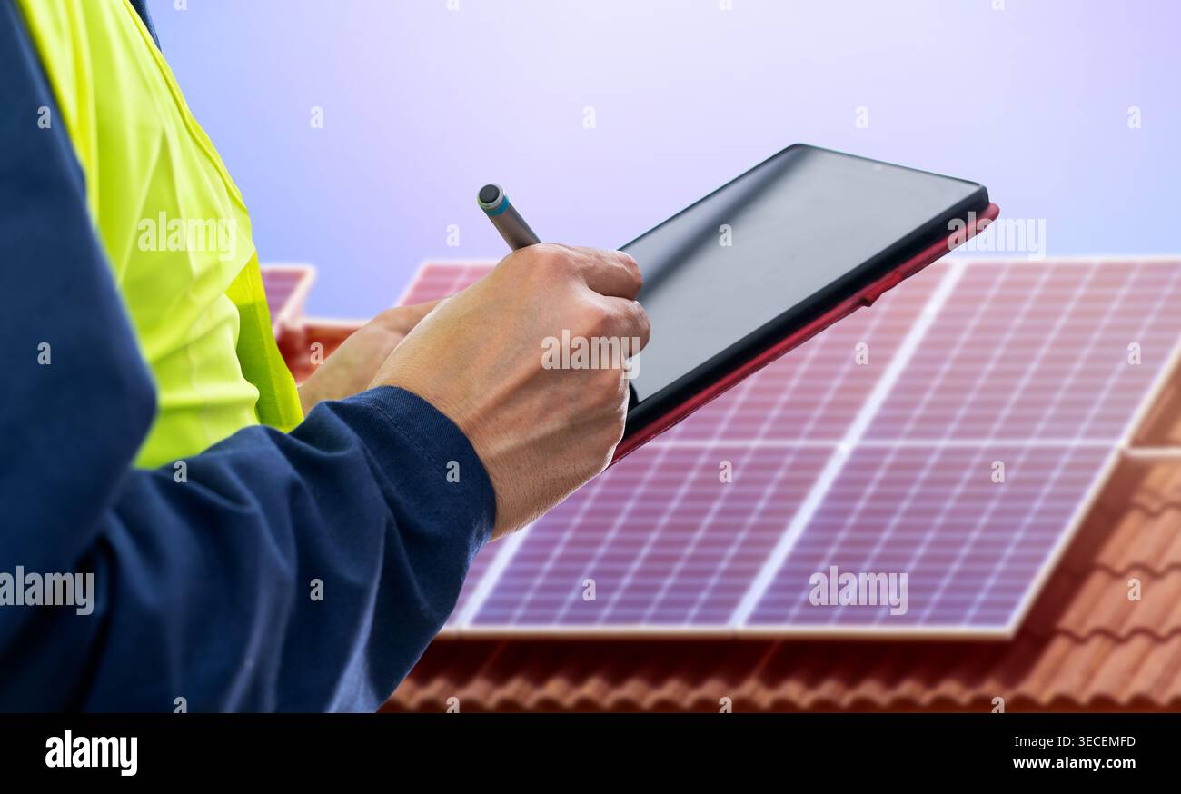 Solar panels,engineer installing solar panels and clean energy with digital tablet Stock Photo