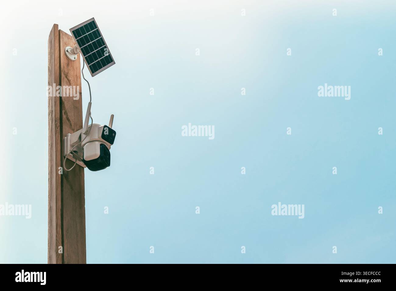Solar-powered outdoor CCTV camera mounted on a pole. Security system Stock Photo