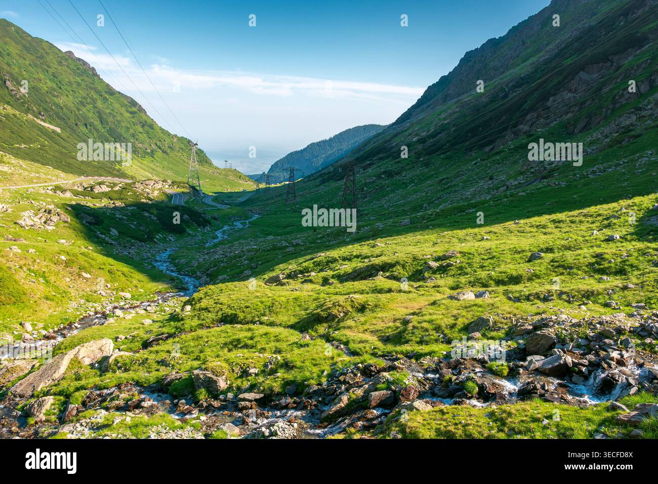 Transfagarasan road through mountains winding uphill. popular highway travel destination of Romania. nice view of mountain on summertime weather. road Stock Photo