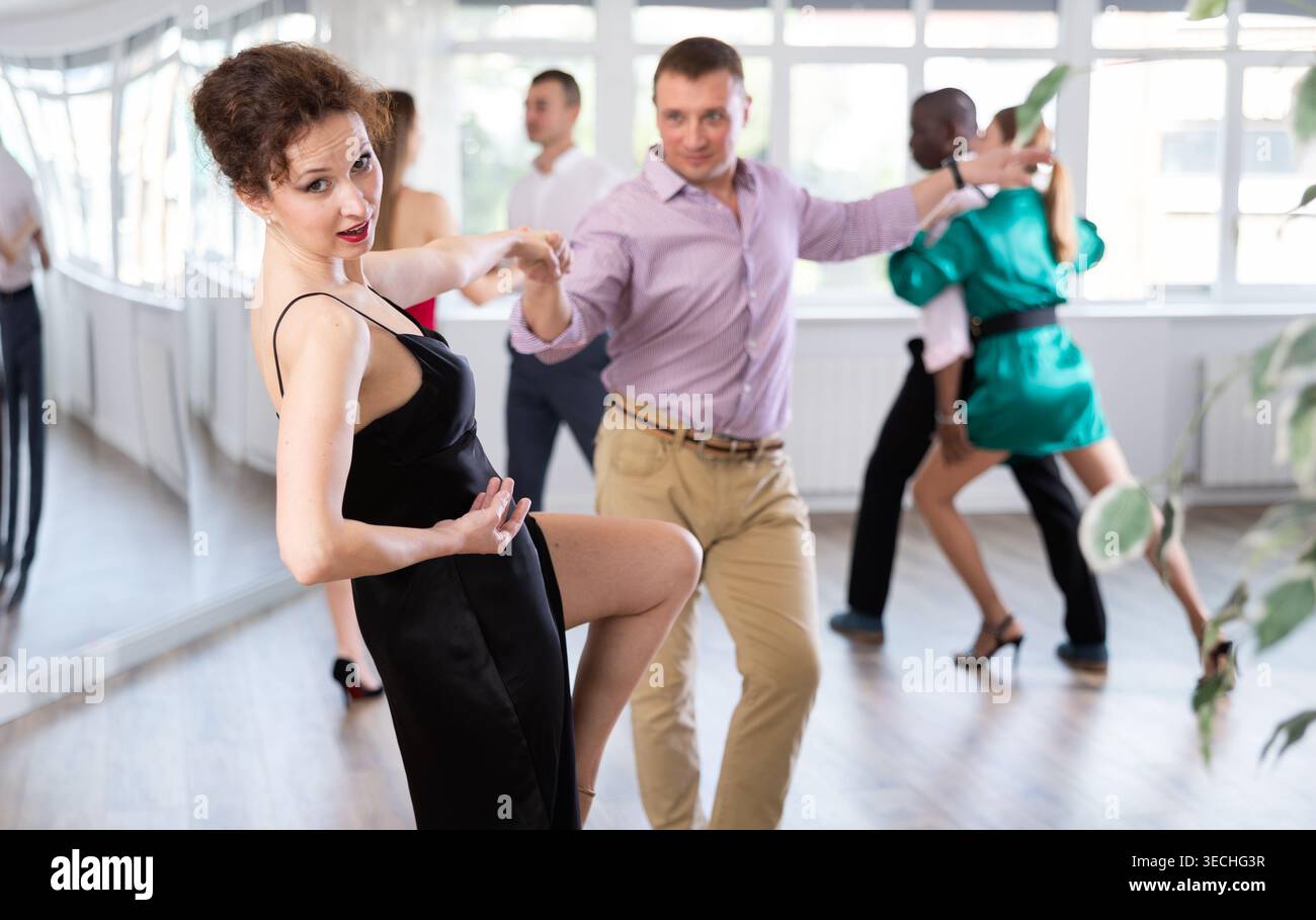Man and woman practicing swing dance in dancing studio Stock Photo