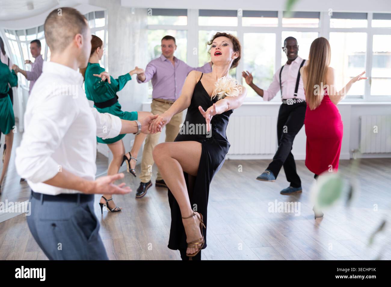 Man and woman practicing swing dance in dancing studio Stock Photo