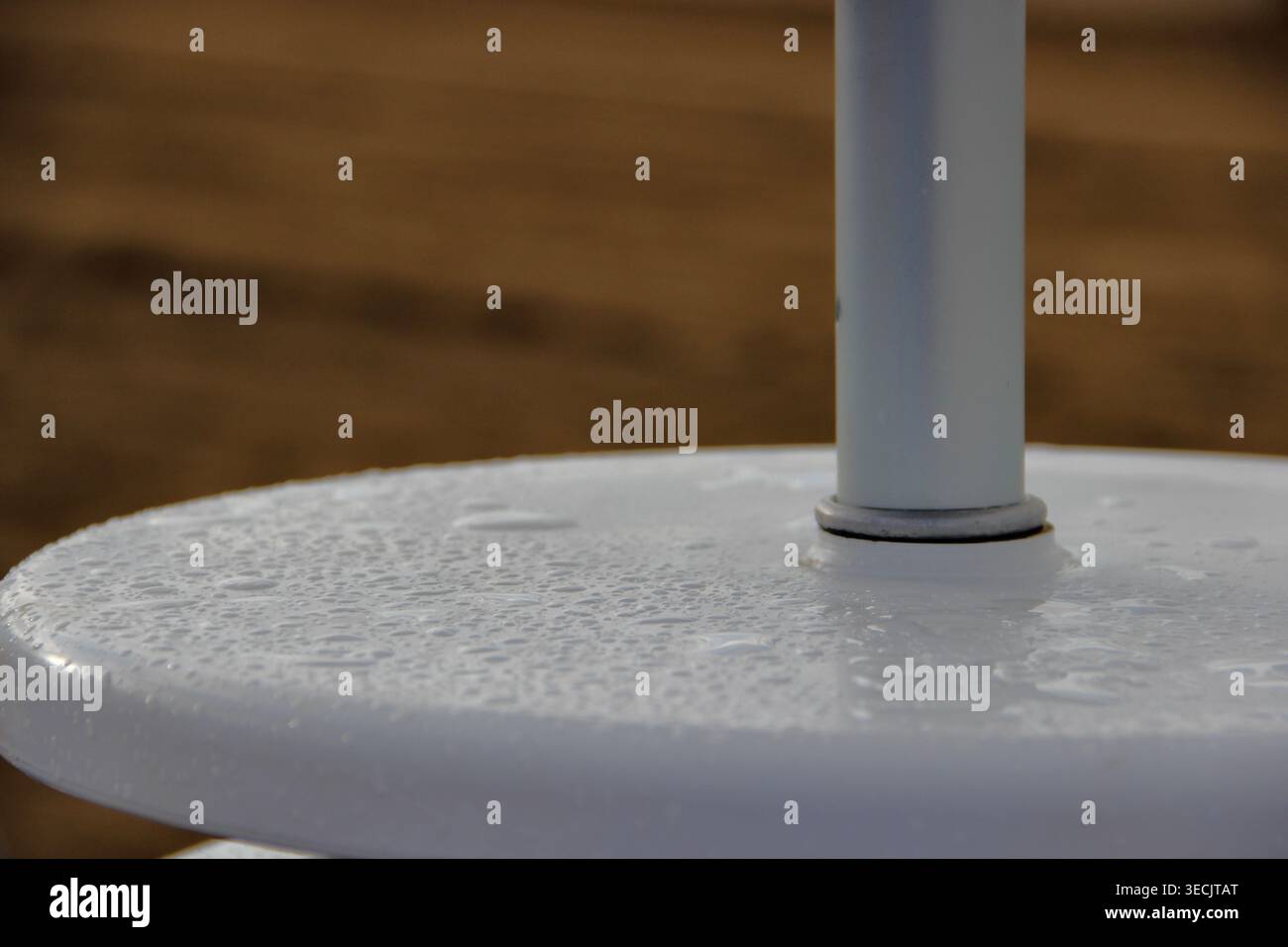 Raindrops on Outdoor Table at the Beach Stock Photo