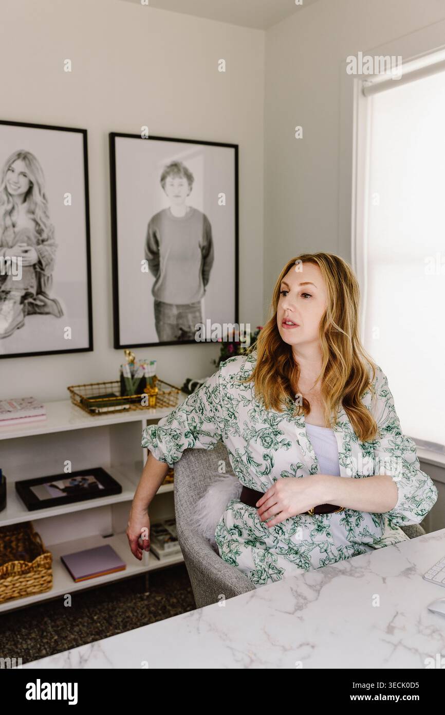 Woman working in stylish home office Stock Photo