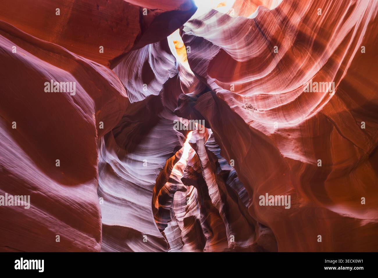 Stunning Swirls of Light and Shadow in a Slot Canyon Formation Stock Photo