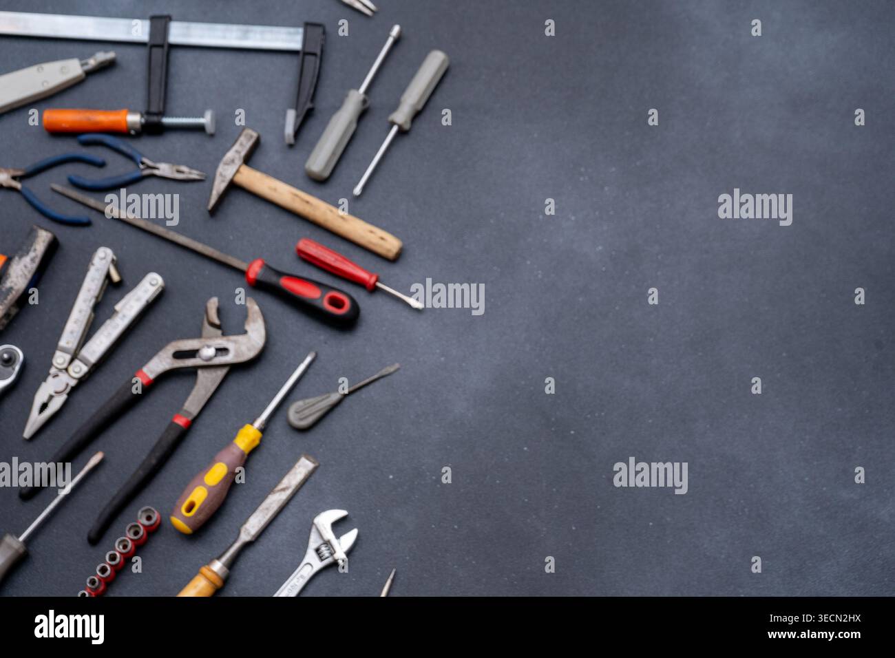 Different Hand Tools on Dark Background copy space. Stock Photo