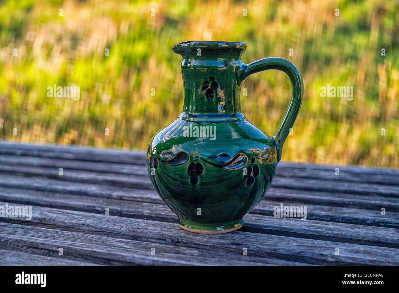 An old jug on a wooden table object, publication Stock Photo