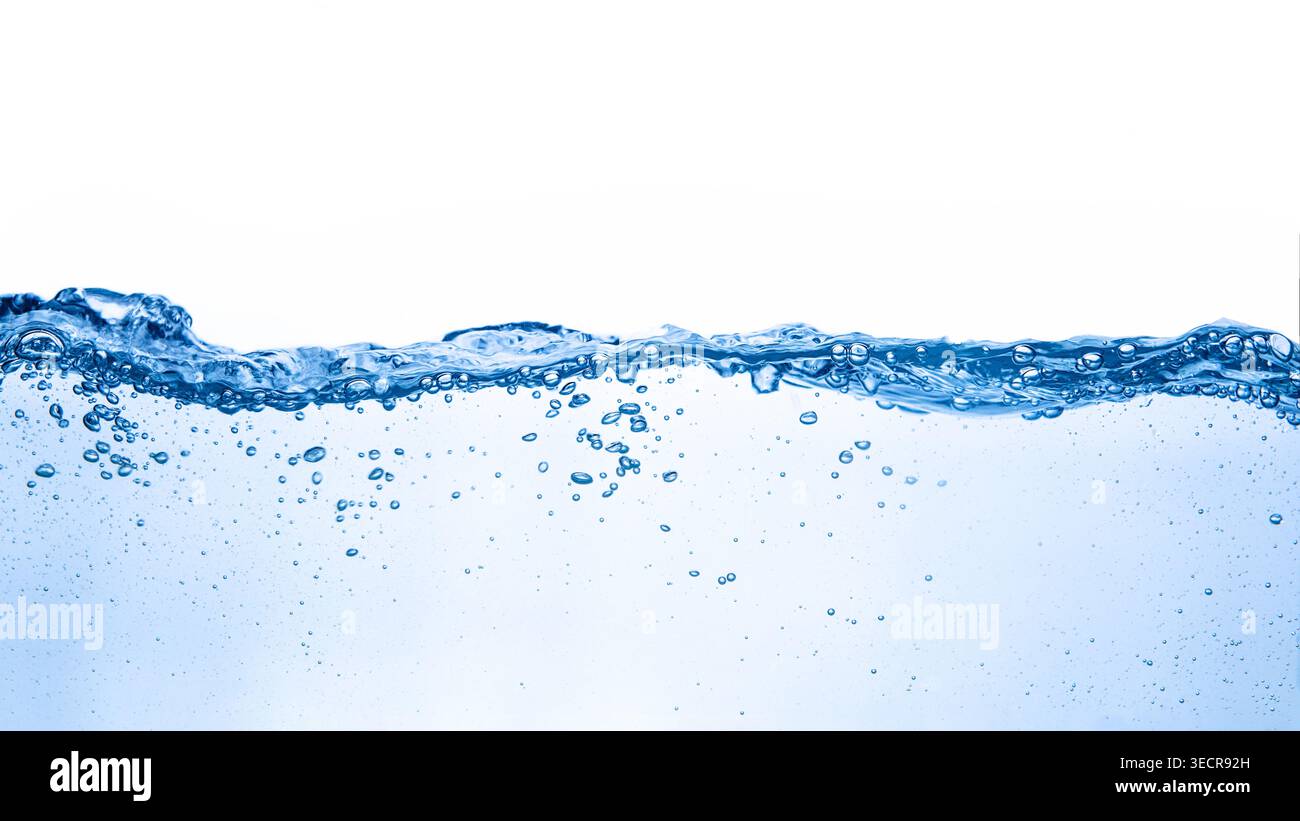 Water creating a ripple surface with tiny air bubbles on a white background Stock Photo