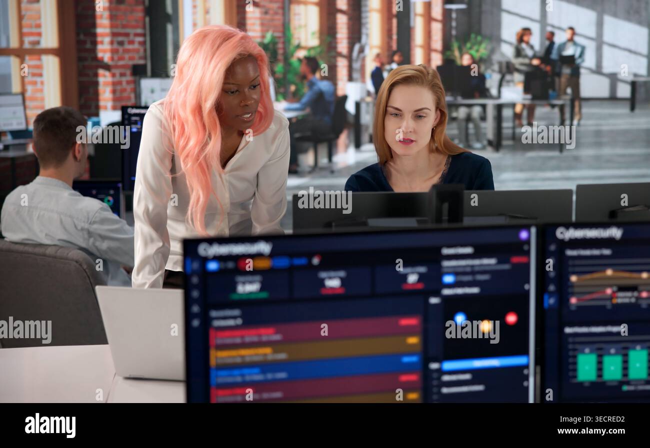 Cybersecurity Engineer Carefully Monitors Network Dashboard To Prevent Breaches. Stock Photo