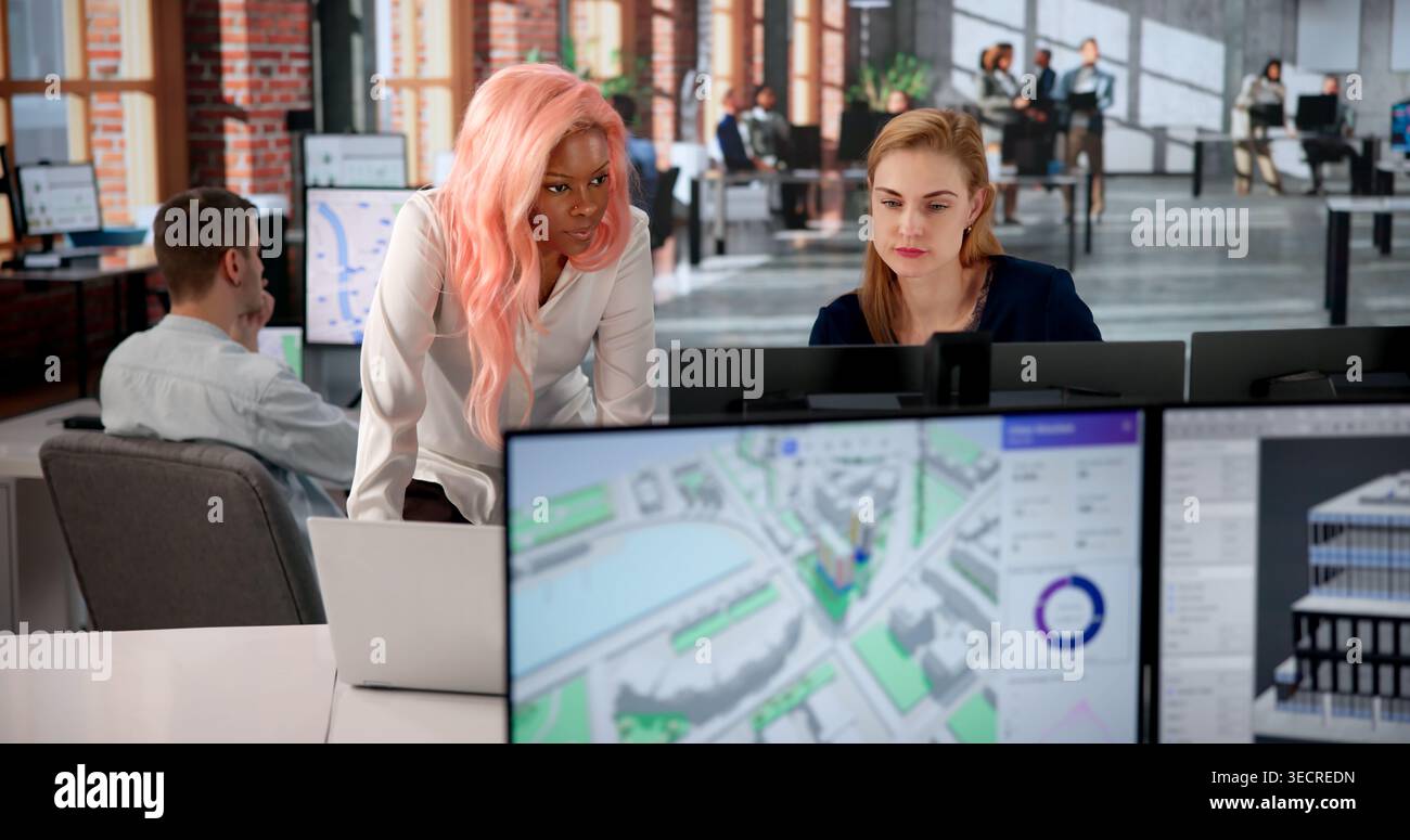 Urban Land Mapping Engineer Studies 3D City Models Using Computer Software. Stock Photo