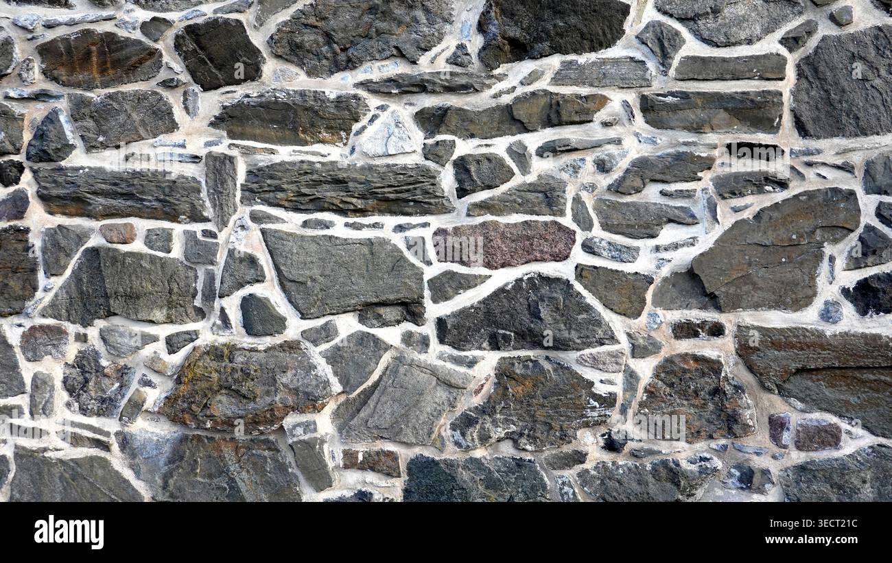 Exterior stone brick wall angled shape medieval Stock Photo