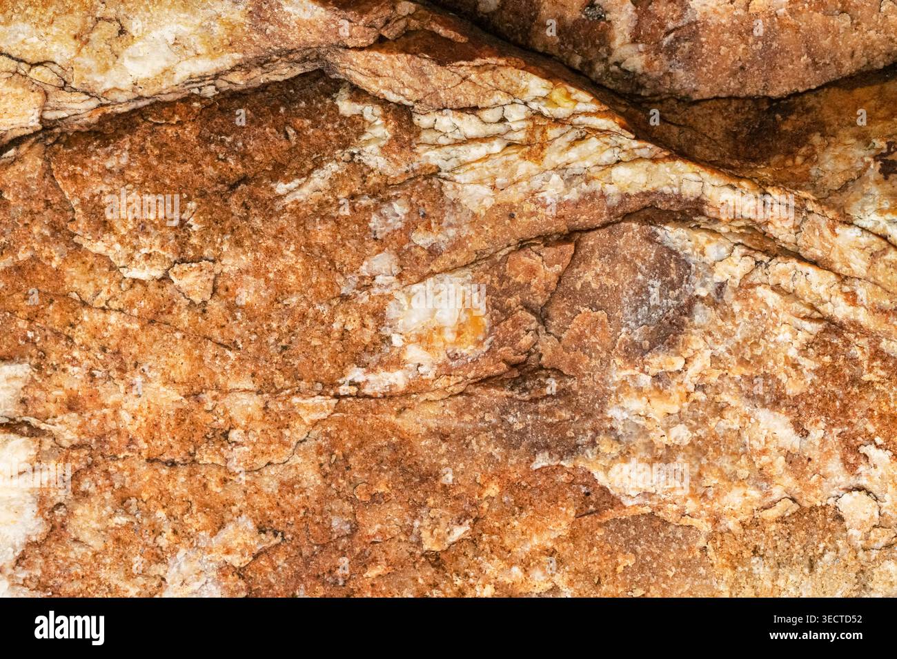 Brown golden  stone rock rough texture macro Stock Photo
