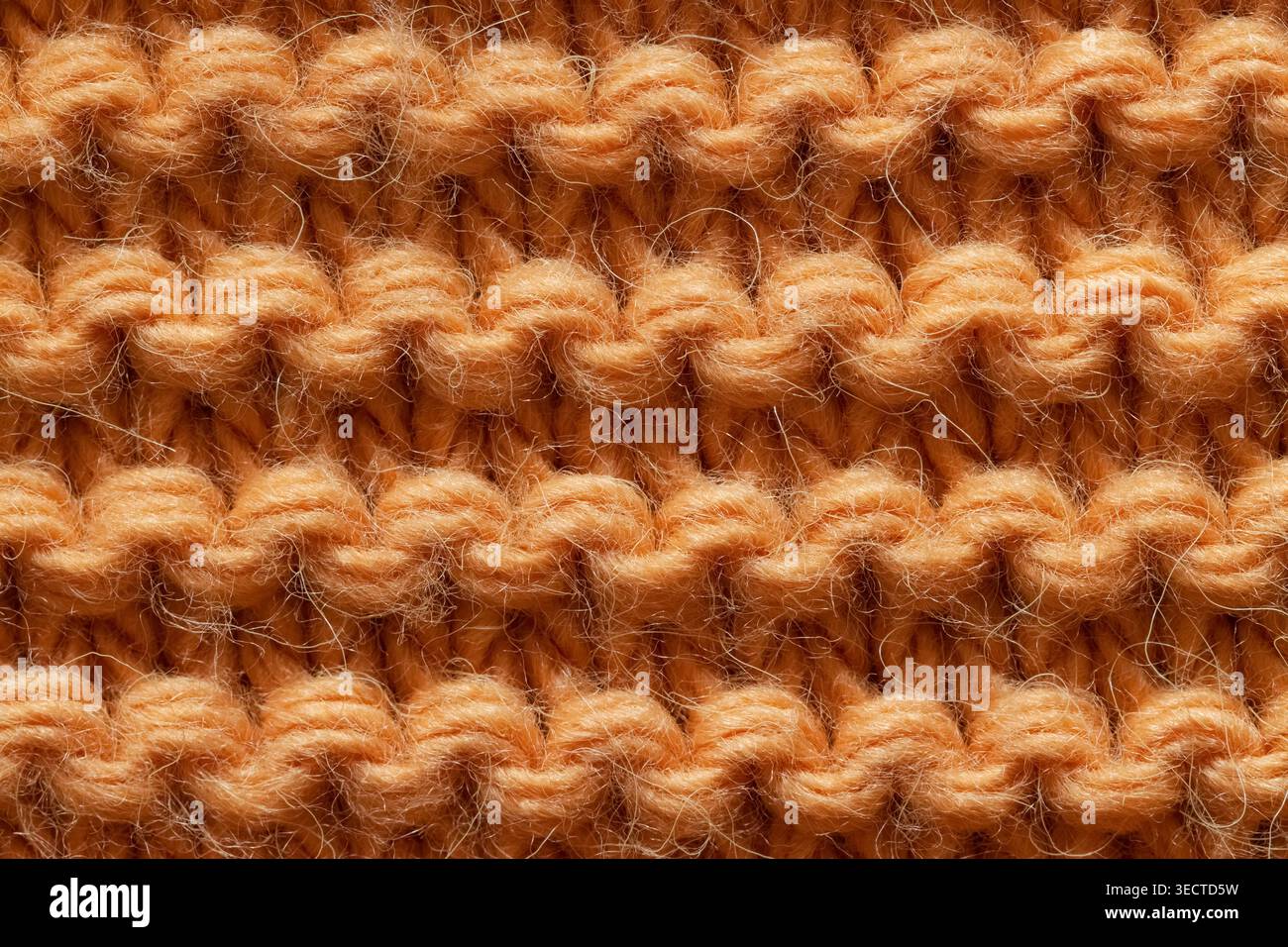 Knitted orange relief horizontal pattern Stock Photo
