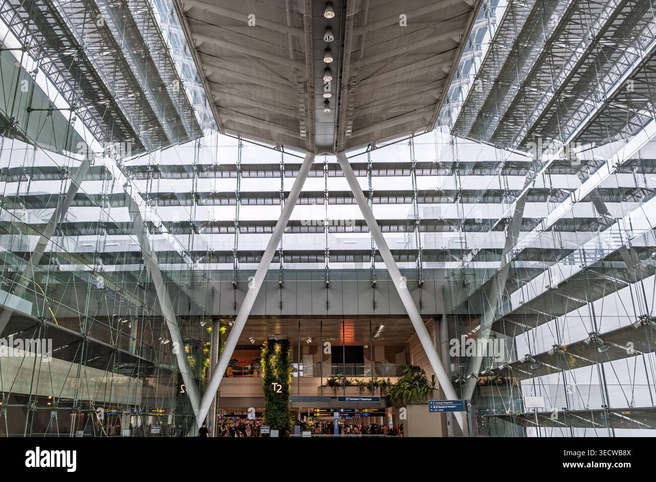 Spacious modern interior with glass walls and structural beams open ...