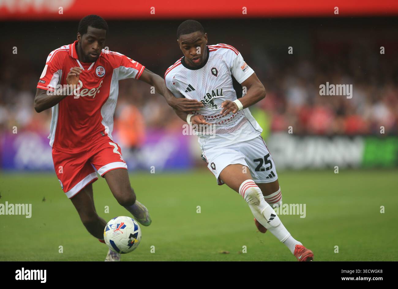 Prince Adeyemo Crawley Town's Ade Adeyemo (left) and Salford City's Princewill ...