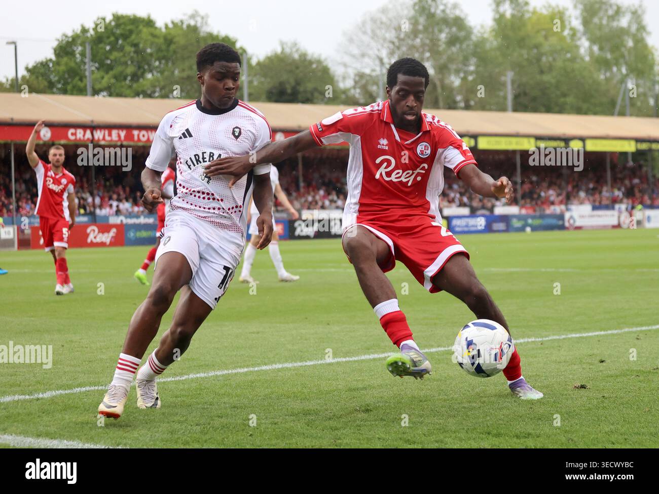 Prince Adeyemo Crawley Town's Ade Adeyemo (right) and Salford City's Princewill ...