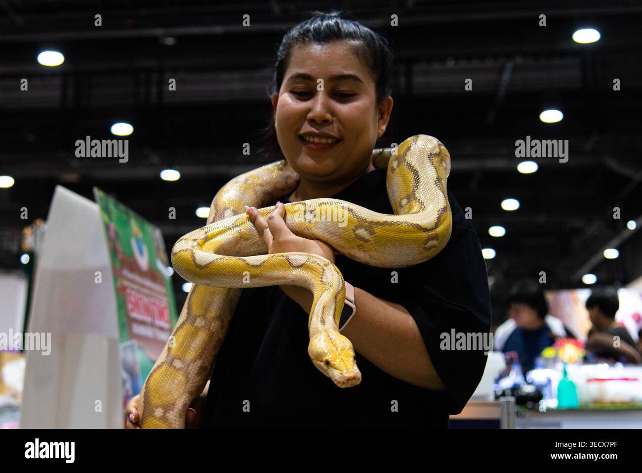 Python Convention People Bangkok, Thailand. 02nd May, 2026. A visitor poses for a photo with a ...