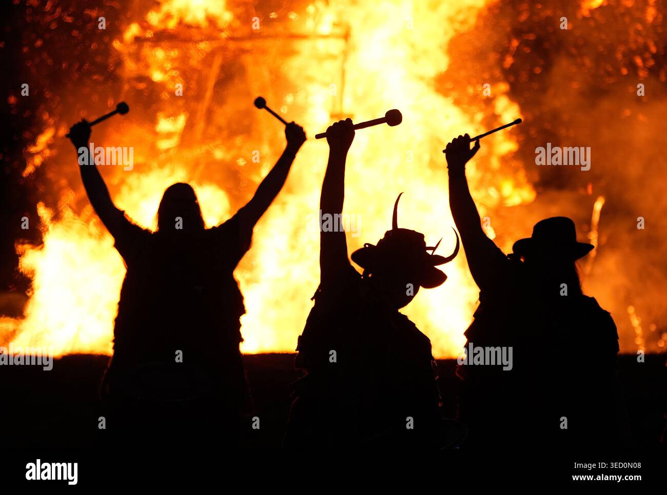 Deltic Fire Members of the Pentacle Drummers perform in front of a burning wicker ...