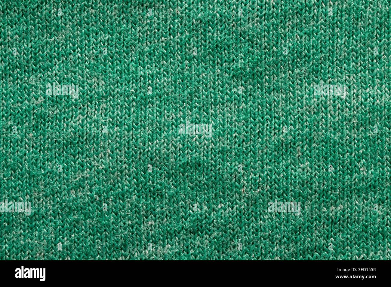 Knitted melange green woolen texture Stock Photo