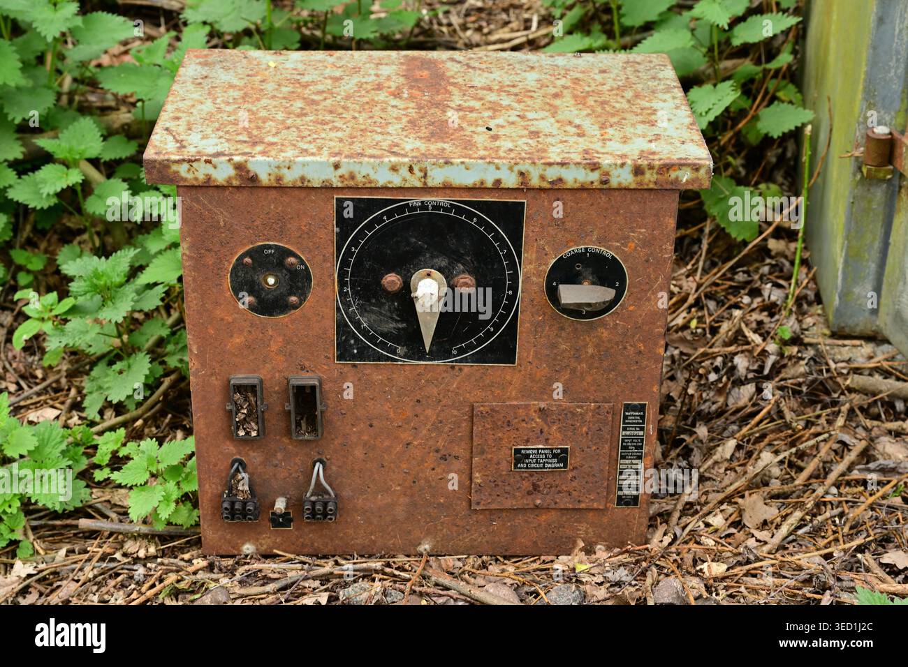 Old electrical control unit in rusty outdoor enclosure, UK Stock Photo