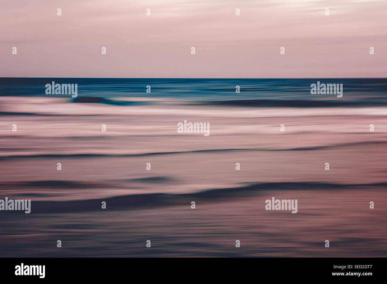 Dreamy pastel ocean waves in soft motion blur Stock Photo