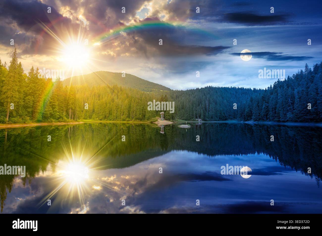 day meet night. landscape by the lake. coniferous forest near the lake and the forest mountain. epic summer solstice view of carpathian mountain refle Stock Photo