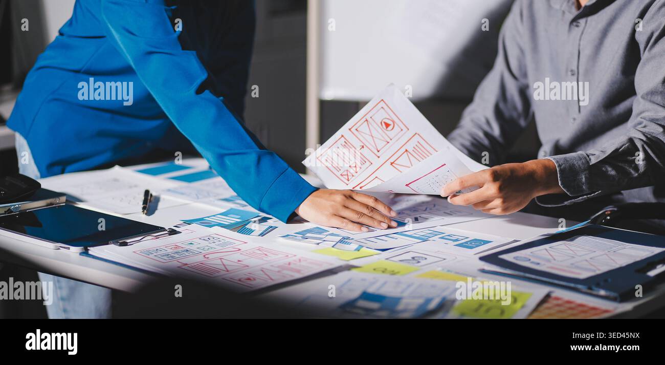 Team of Program Developer Collaborating on UXUI Design Planning in a Modern Office Environment Stock Photo