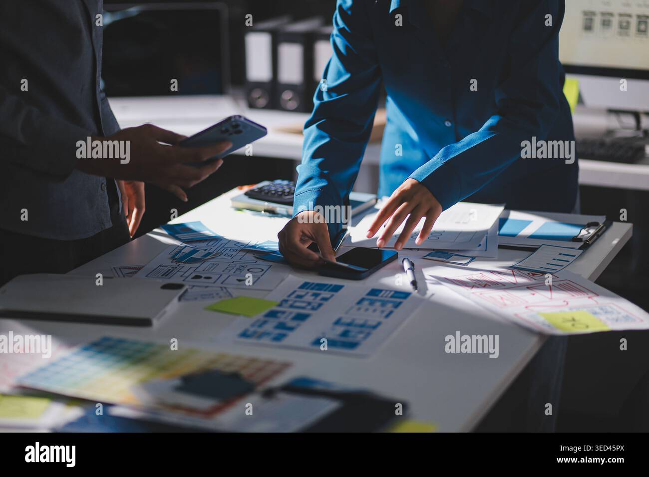 Team of Program Developer Collaborating on UXUI Design Planning in a Modern Office Environment Stock Photo