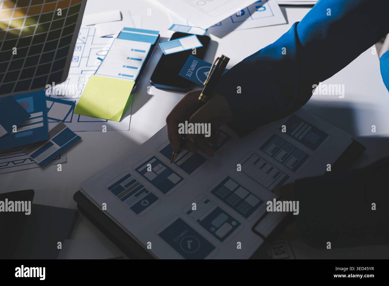 Team of Program Developer Collaborating on UXUI Design Planning in a Modern Office Environment Stock Photo