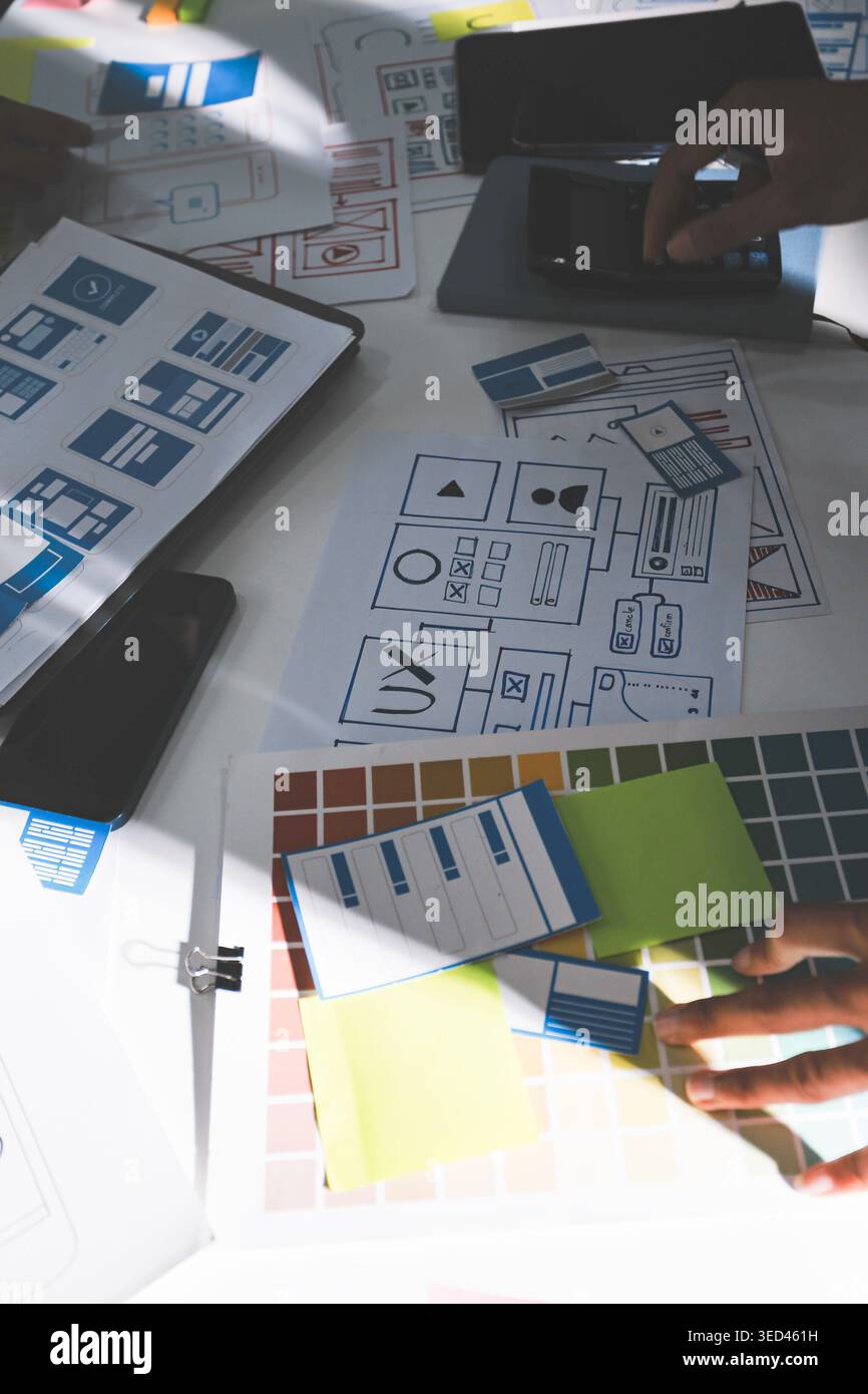 Team of Program Developer Collaborating on UXUI Design Planning in a Modern Office Environment Stock Photo