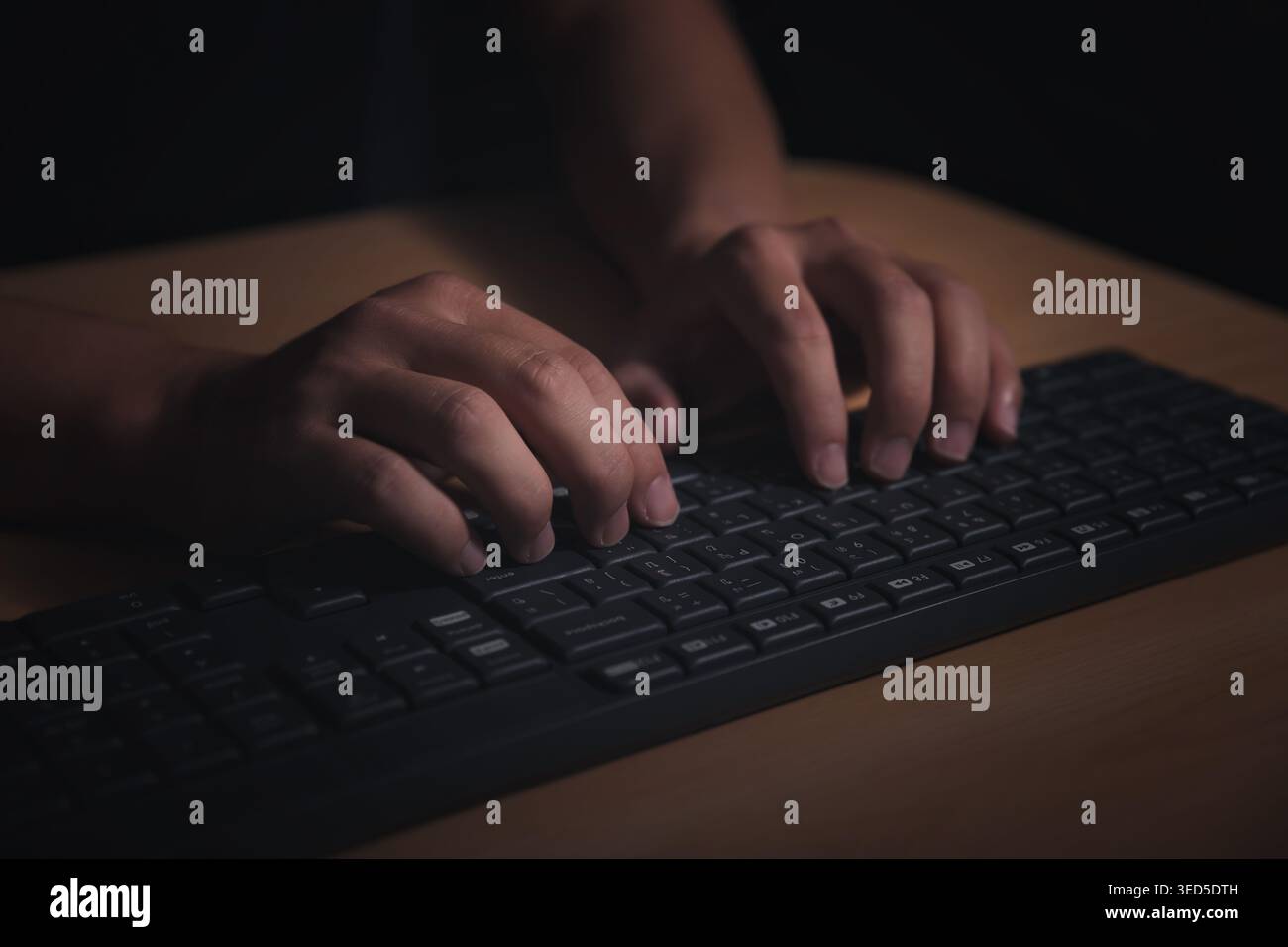 Man's hands using a computer keyboard to searching for information. Searching browsing internet data information with computer keyboard. Using search Stock Photo
