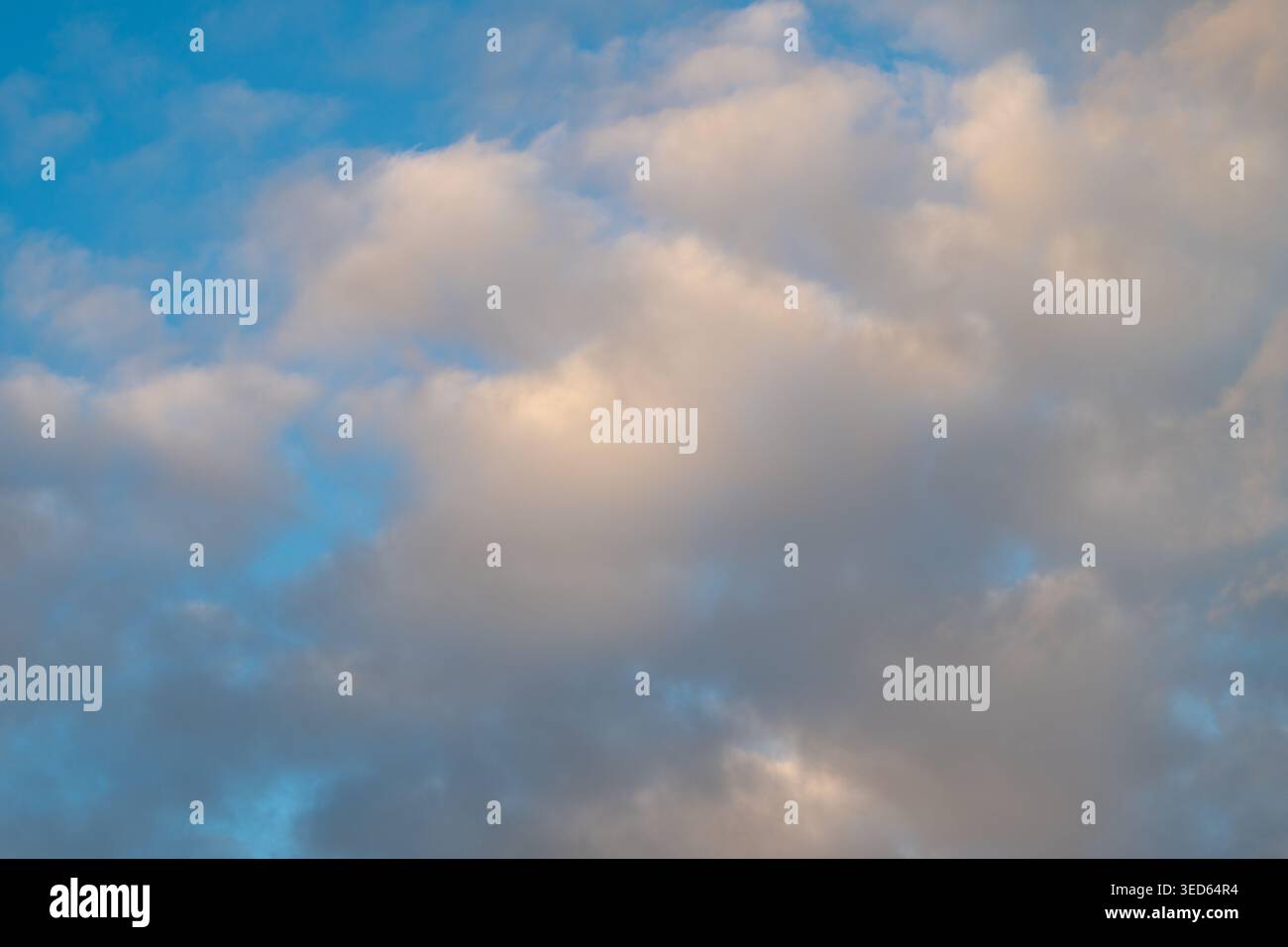 Sunrise clouds opening to clear azure sky, airy misty pockets and wide ...