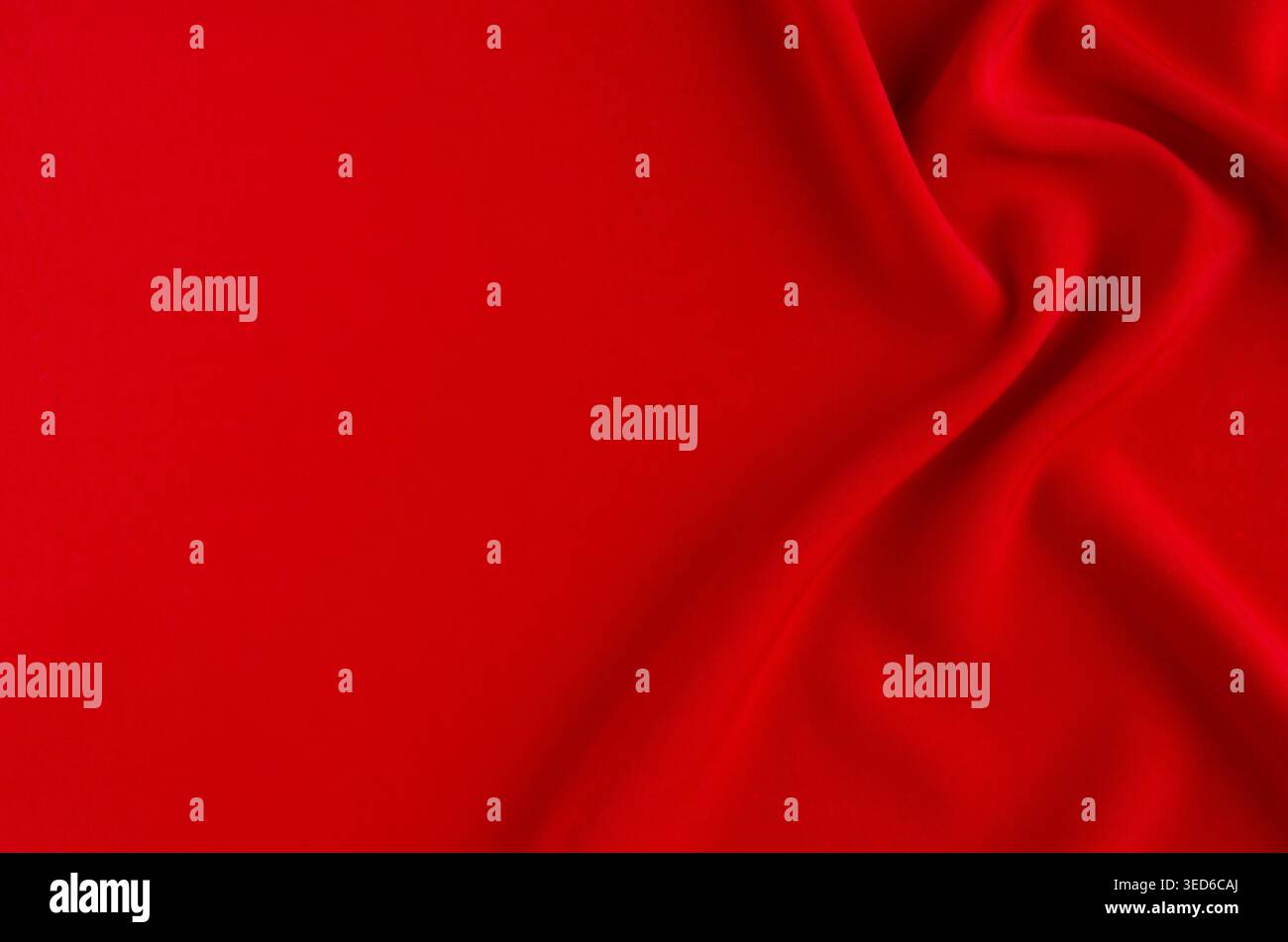 Deep red silk smooth background with copy space. Abstract love backdrop. Stock Photo