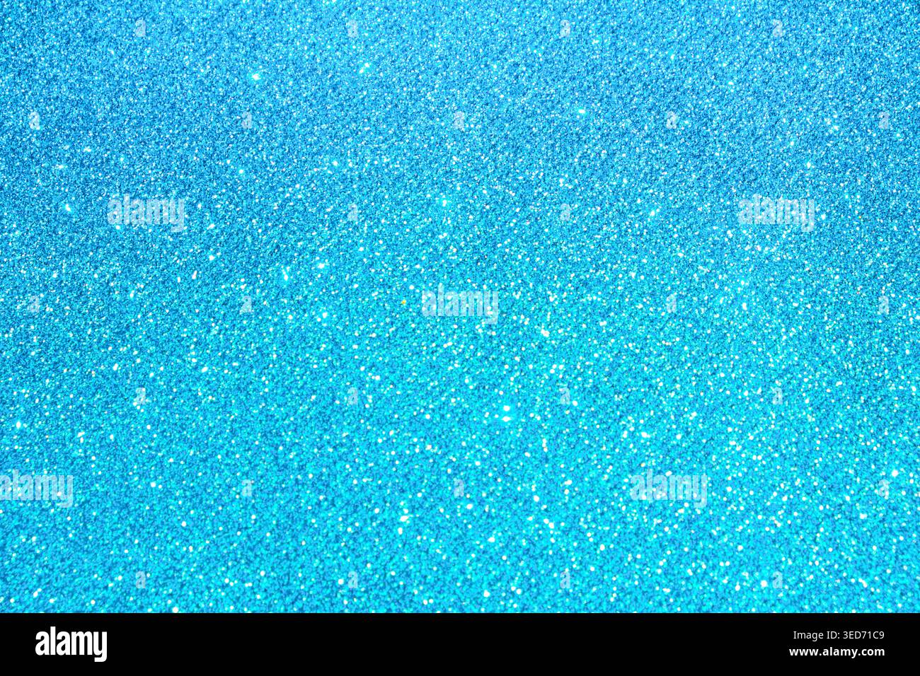 Blue abstract glitter texture background with shimmering bokeh-like particles, front view, luminous decorative surface Stock Photo