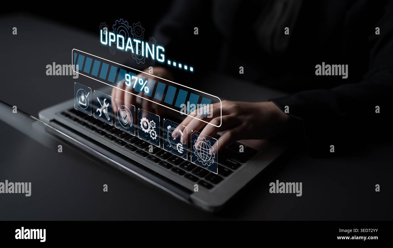 Modern Business Technology Update Progress on Laptop with Hands Typing and Graphic User Interface Elements Visible Sigmoid Stock Photo