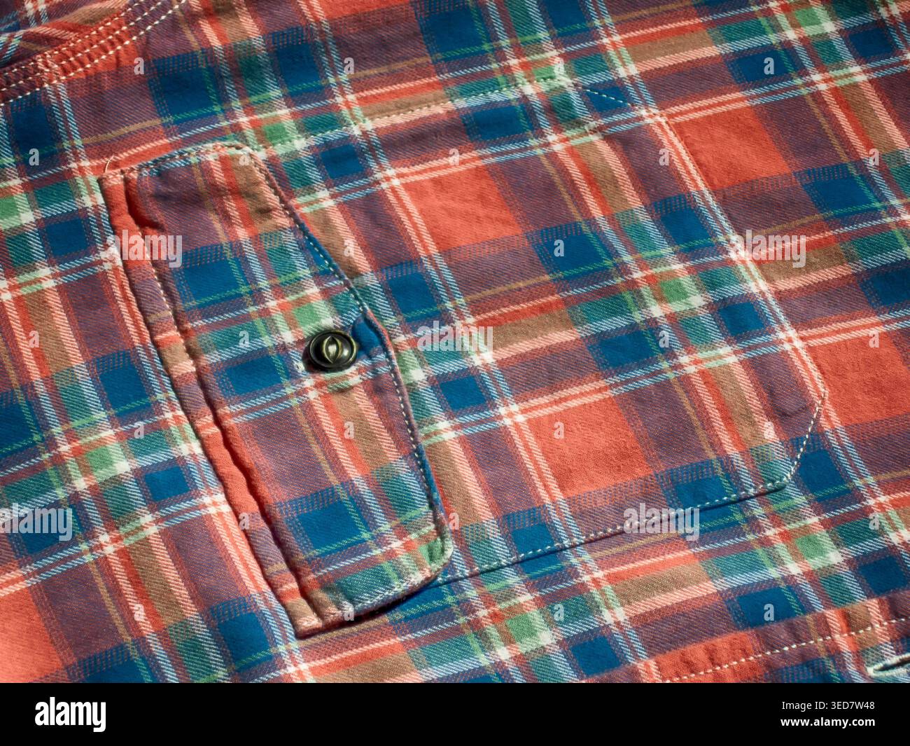 Blue-red check pocket, button, textile background Stock Photo