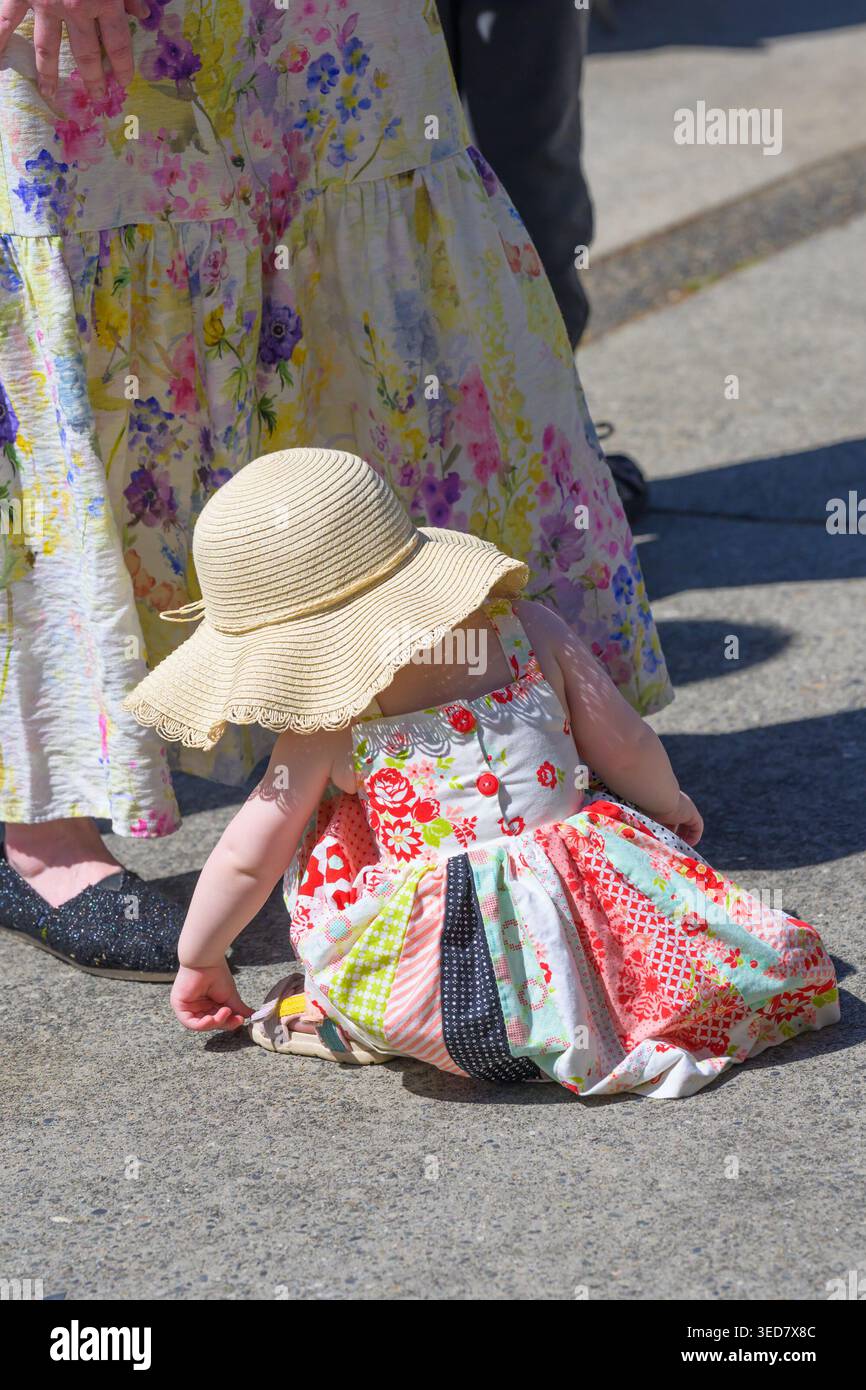 Mother and daughter wearing floral print dresses on a lovely Spring day. Stock Photo