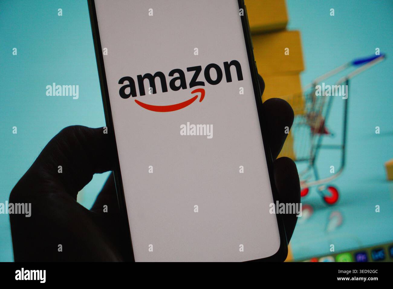 The Amazon logo displayed on a smartphone screen Stock Photo