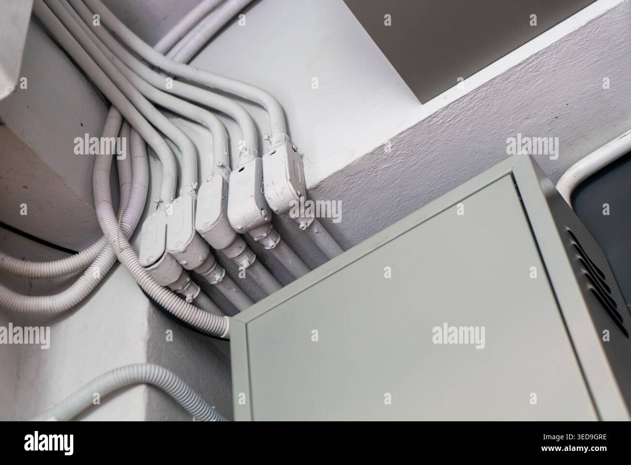 Close-up of multiple electrical cables connected to a junction box on a ...
